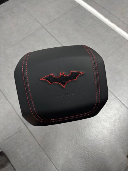 Custom airbag cover with red bat embroidery and stitching