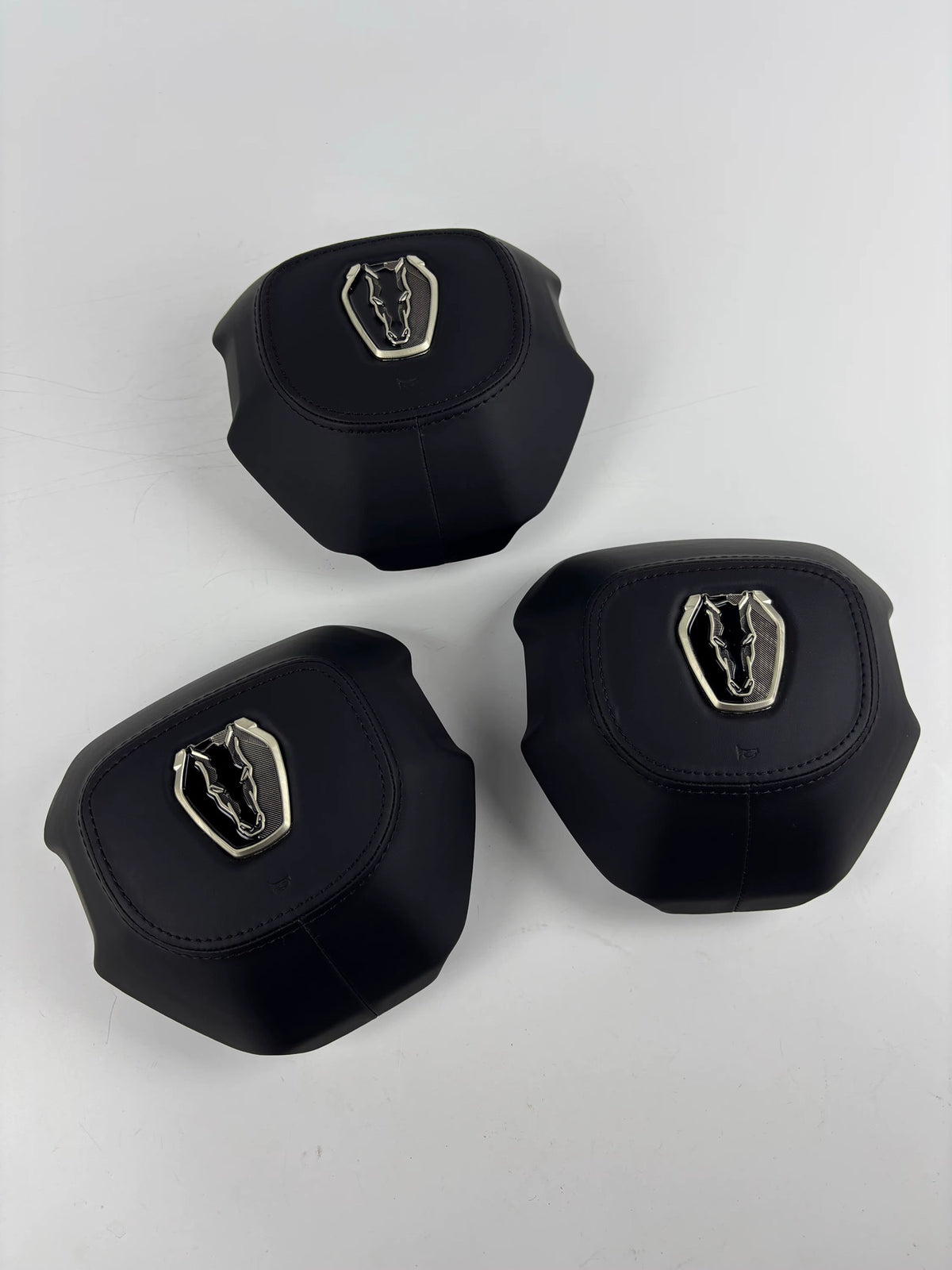 Black custom airbag covers with horse emblems